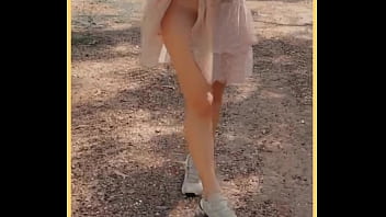 Milf shows her shaved pussy in public