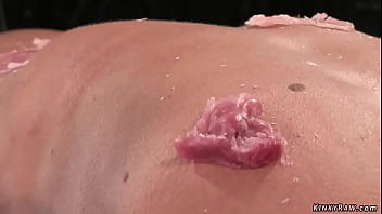 Gagged brunette slave cecilia vega is bound to wooden post and gets pussy vibrated then laid in wooden stock gets waxed and caned on device bondage