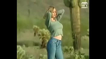 Hot blonde model with big tits shooting topless in the desert