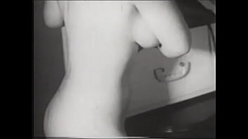 Busty blonde smiles for the camera and she bares it all