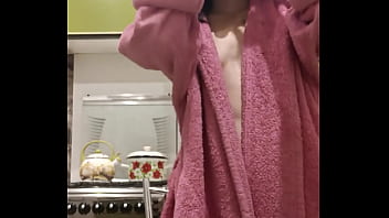 Raven haired petite chick rubs and fucks her tight pussy in the kitchen