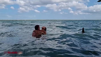 Romantic sex of a beautiful couple in lagoon