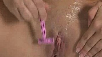 Big breasts babe shaving pussy