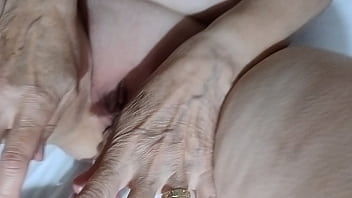 She pees on the dildo and sucks it clean