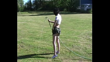 Zoe plays with water hose wetting pierced tits & her pussy