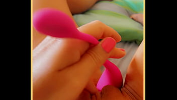 Milf touches her toy on her smooth pussy