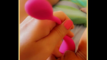 Milf touches her toy on her smooth pussy