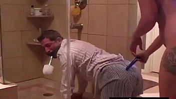 Man slave made to clean floor