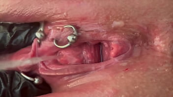 Pee very strong stream from my pierced pussy and my hands in latex glove