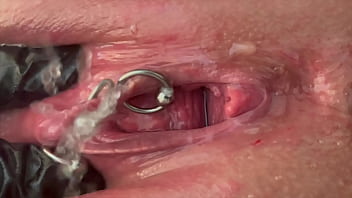 Pee very strong stream from my pierced pussy and my hands in latex glove