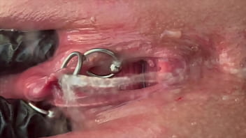 Pee very strong stream from my pierced pussy and my hands in latex glove