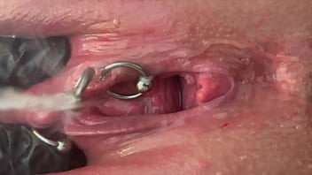 Pee very strong stream from my pierced pussy and my hands in latex glove