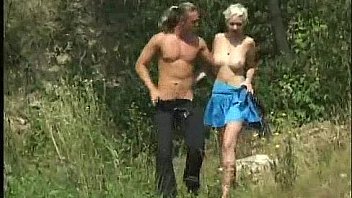 Blonde beauty takes a walk in the woods