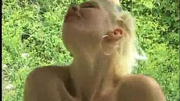 Blonde beauty takes a walk in the woods