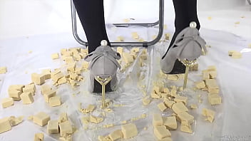 Beautiful legs woman slams food with legs