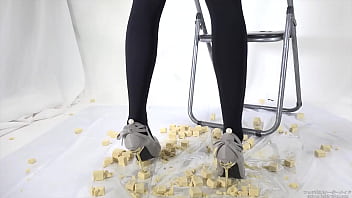 Beautiful legs woman slams food with legs
