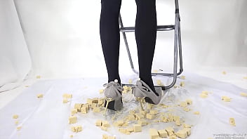 Beautiful legs woman slams food with legs