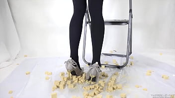 Beautiful legs woman slams food with legs