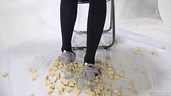 Beautiful legs woman slams food with legs