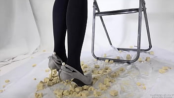 Beautiful legs woman slams food with legs