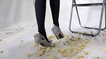 Beautiful legs woman slams food with legs