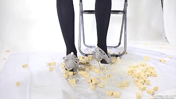 Beautiful legs woman slams food with legs