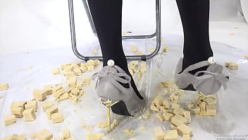 Beautiful legs woman slams food with legs