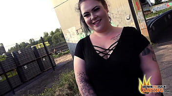 Tattooed slut sucks stranger's dick in public