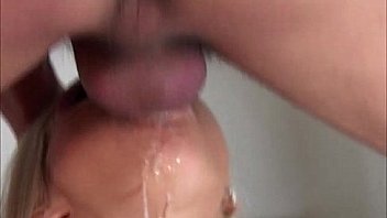 Drooling blonde gargles fat cock