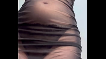 Redhead shaking ass in see through dress