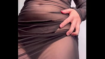 Redhead shaking ass in see through dress