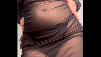 Redhead shaking ass in see through dress