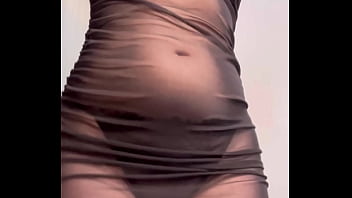 Redhead shaking ass in see through dress