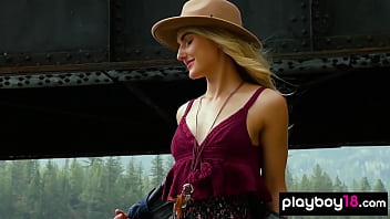 Skinny blondie stripping and posing naked by the river