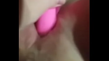 Blonde girl uses a dildo