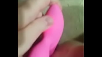Blonde girl uses a dildo