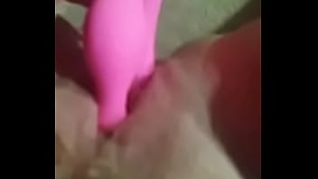 Blonde girl uses a dildo