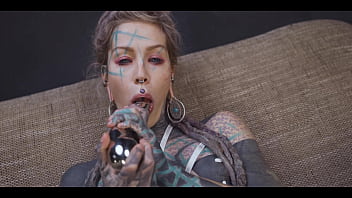 Tattoo girl gets a stainless steel dildo to shove up her ass