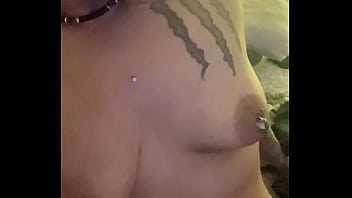 What is she doing to her tits