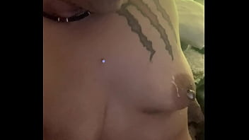 What is she doing to her tits