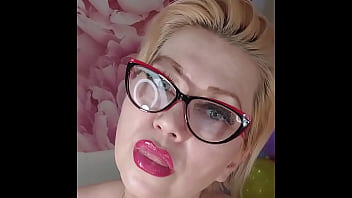 Dildoing of a mature bitch on a background of colorful balloons