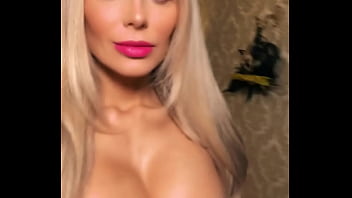 Pornstar showing off her tits in a tight corsette