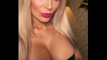 Pornstar showing off her tits in a tight corsette