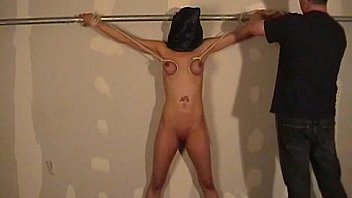 Hooded amateur bdsm and big tit whipping of danii in bondage and dungeon punishm