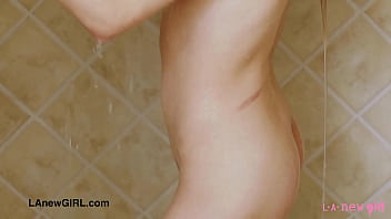 Radiant teen model enjoys a sensual bath