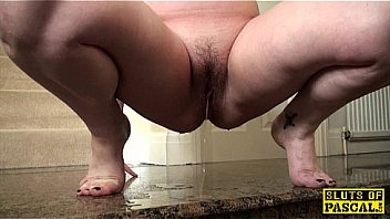 Pissing uk slut squats and wets the floor