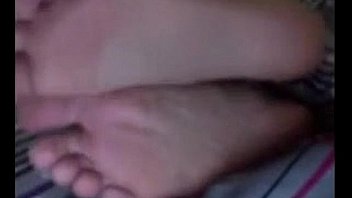 Cute latina teasing her feet and soles