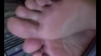 Cute latina teasing her feet and soles