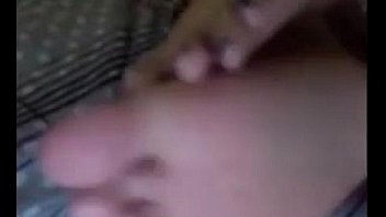 Cute latina teasing her feet and soles