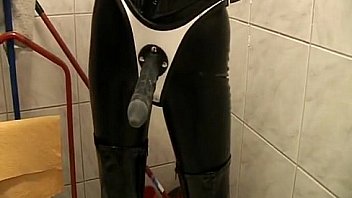 Two dominas drop candle wax on a slave